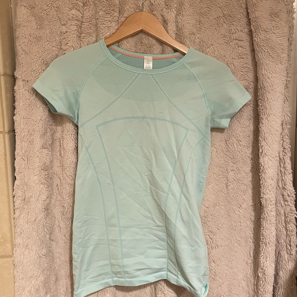 Light blue athletic top size 14